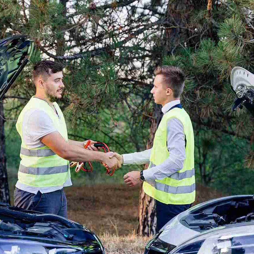 two-men-in-a-green-safety-vest-are-talking-to-each-2024-10-18-08-55-31-utc_11zon
